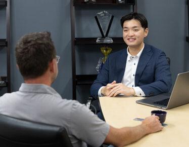 A KCIIS advisor reviewing different types of retirement accounts with a client during a planning session