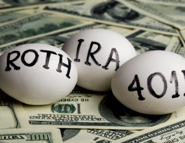Three eggs labeled Roth IRA, IRA, and 401(k) resting on a pile of hundred-dollar bills, representing different retirement account types