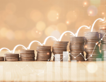 Ascending stacks of coins with an upward arrow and growth chart overlay, representing compounding retirement income growth